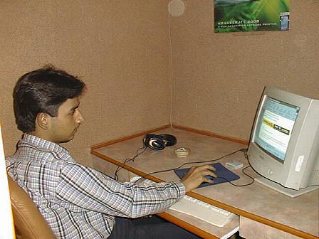 Yahoo Cyber Cafe - Indoor View - Customer is busy in browsing.